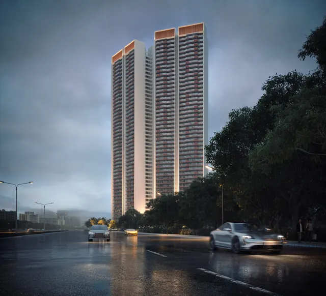 Adani The Marq — towers from expressway at dusk