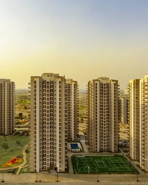 Adani Oyster Grande — aerial view of towers and landscaped grounds (real photo)