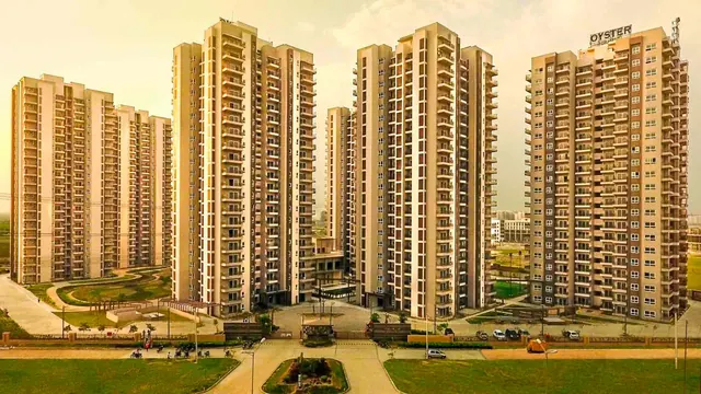 Adani Oyster Grande — towers at golden hour (real photo)