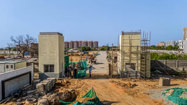 Adani Tatva Estates — site entrance under construction, Apr 2025 (real photo)