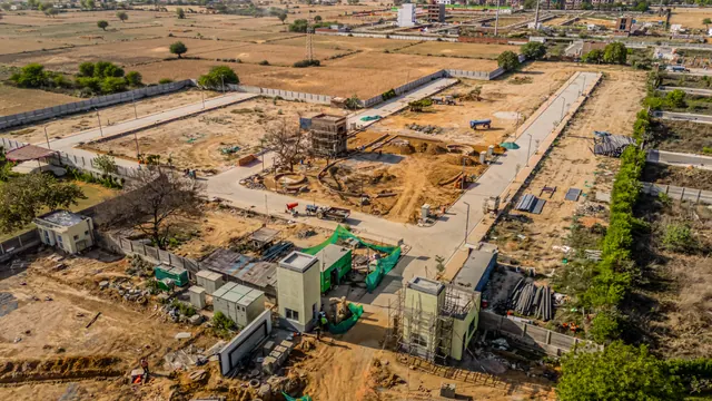 Adani Tatva Estates — construction progress aerial, Apr 2025 (real photo)