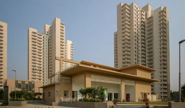 Alpha Gurgaon One — clubhouse with towers (real photo)