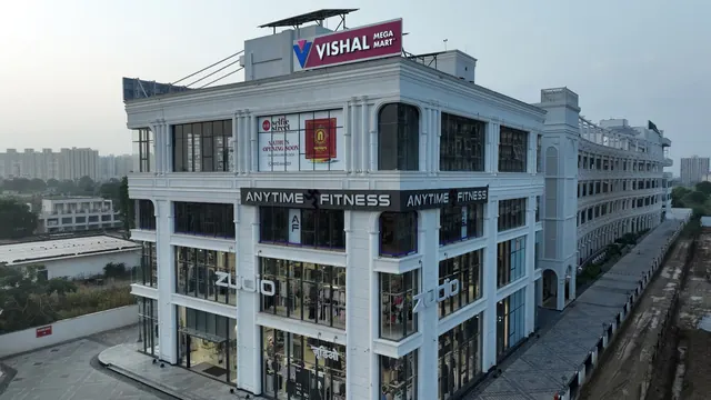 AMB Selfie Street — aerial front view of completed building (real photo)