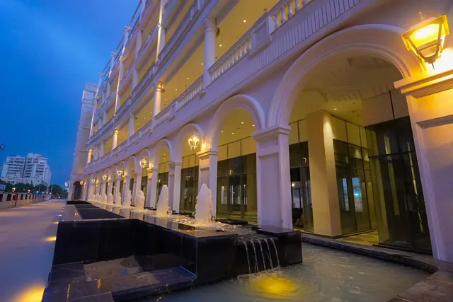 AMB Selfie Street — arched colonnade with fountains at dusk