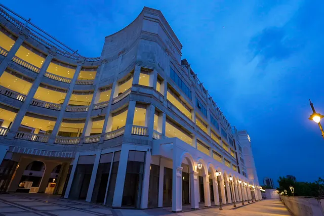 AMB Selfie Street — corner elevation at blue hour