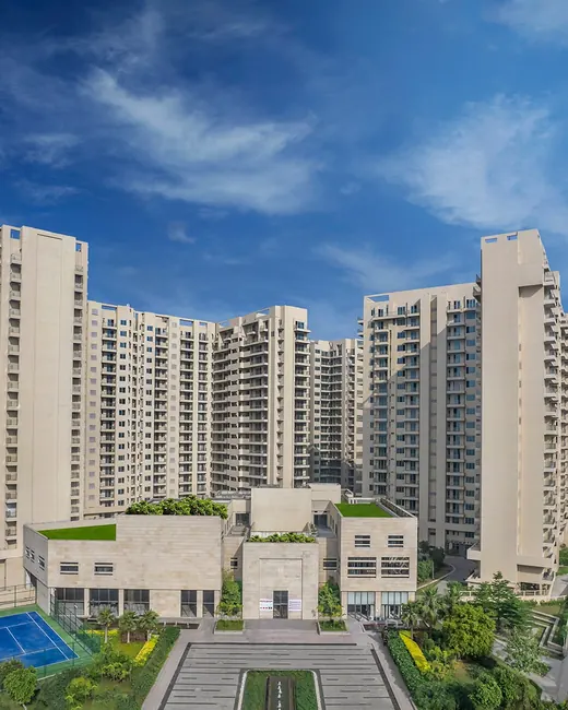 Ambience Creacions — towers with clubhouse and courts (real photo, square)