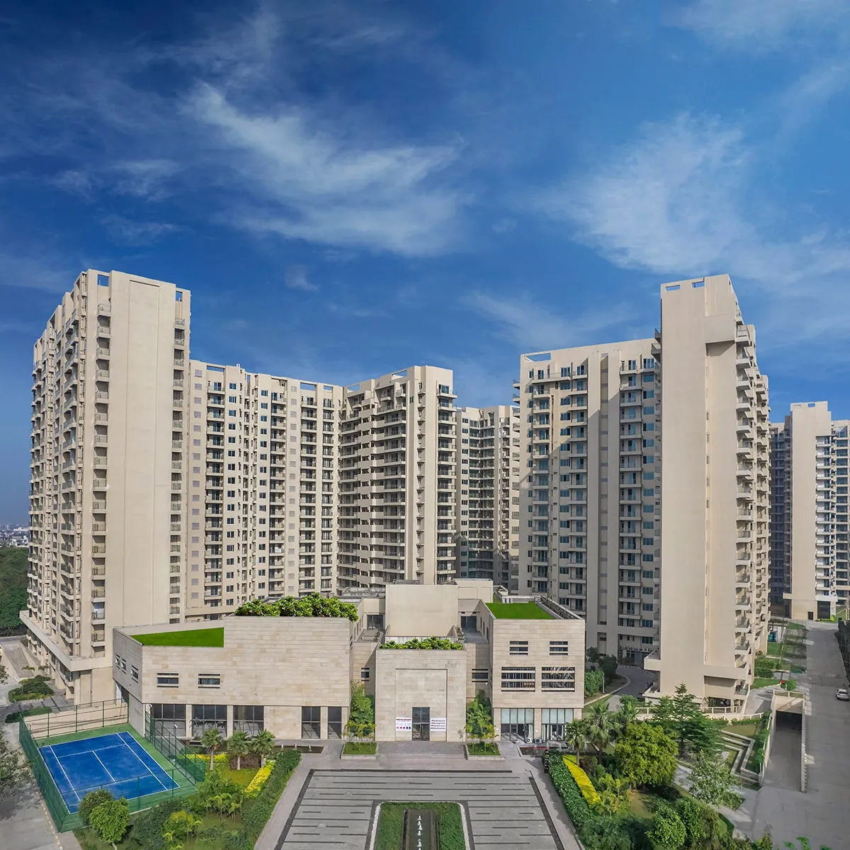 Ambience Creacions — towers with clubhouse and courts (real photo, square)