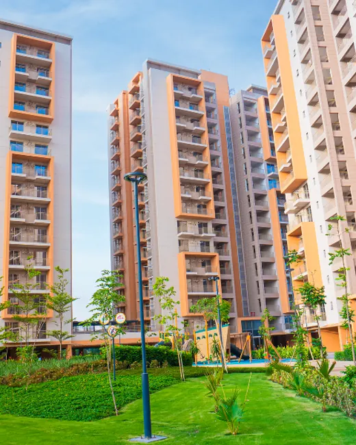 Ashiana Amarah — completed towers with landscaped lawn (real photo)