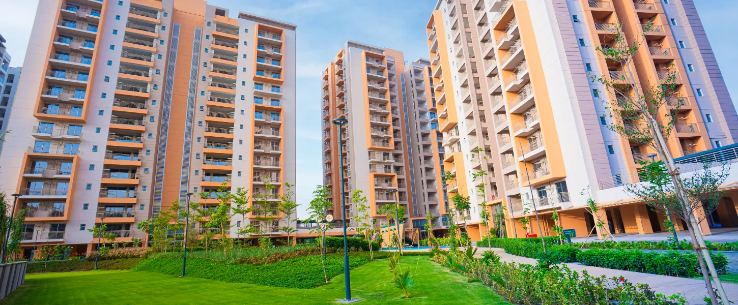 Ashiana Amarah — completed towers with landscaped lawn (real photo)