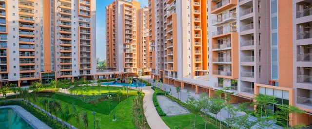 Ashiana Amarah — towers and landscaped courtyard (real photo)