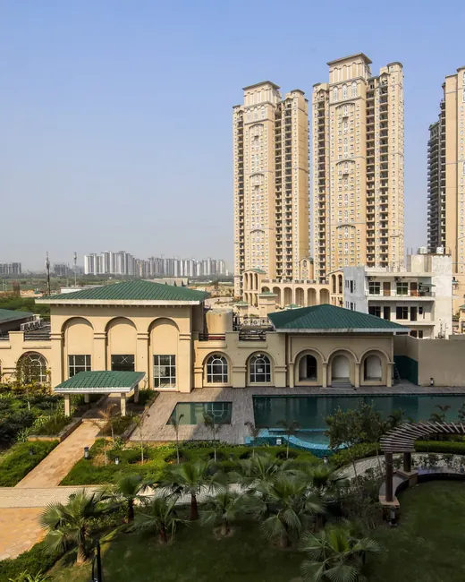 ATS Triumph — towers behind clubhouse and pool (real photo)