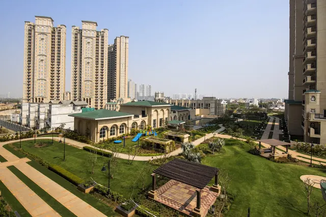 ATS Triumph — towers and landscaped central garden (real photo)