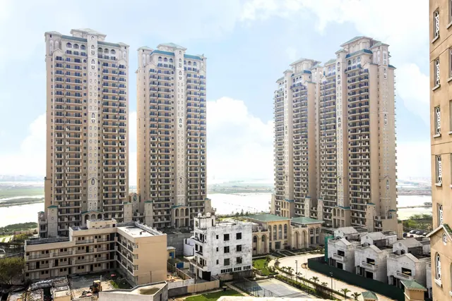 ATS Triumph — towers with villas/low-rise blocks (real photo)
