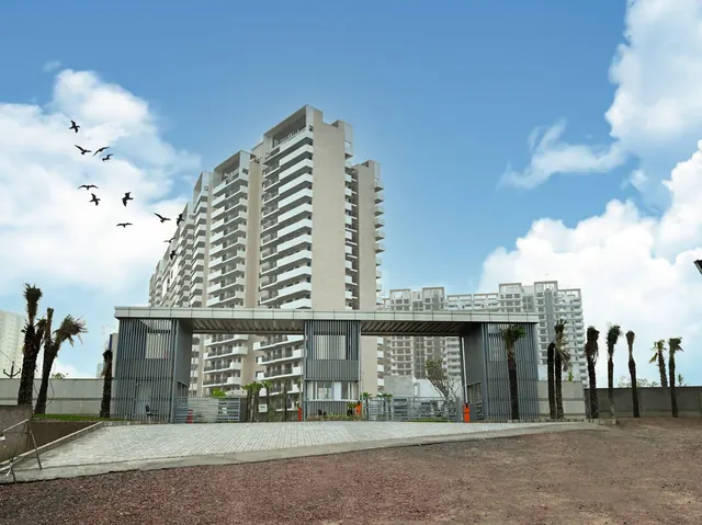 Bestech Altura — entrance gate and towers (real photo)