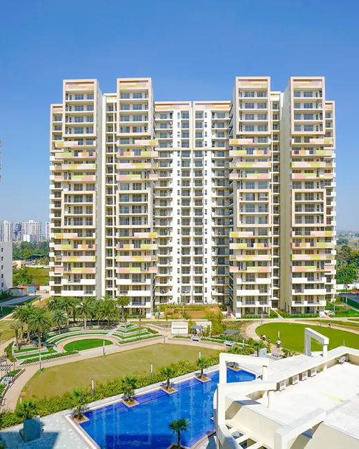 Bestech Park View Sanskriti — towers around central landscaped court and pool (real photo)