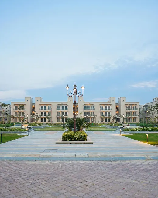 BPTP Amstoria — low-rise floors with landscaped central avenue (real photo)