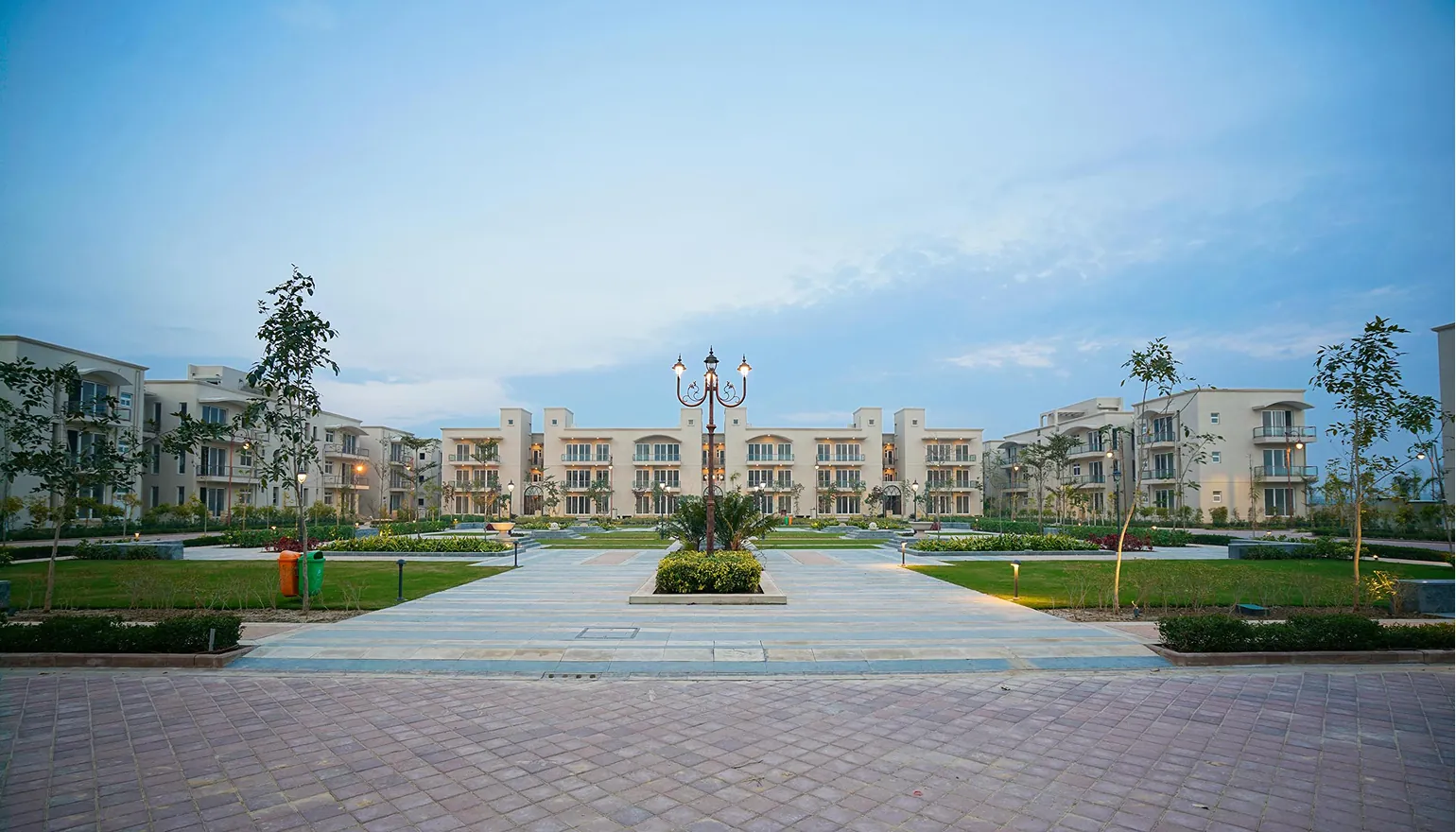 BPTP Amstoria — low-rise floors with landscaped central avenue (real photo)