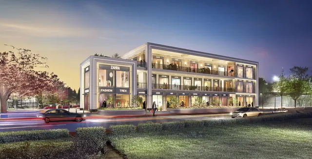 DLF Club Arcade — Dusk render of the Club Arcade facade with lit shopfronts