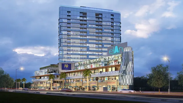 Elan Mercado — Dusk view of the retail podium and tower (render)