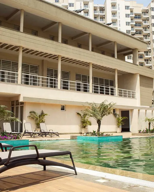 Experion Heartsong — clubhouse with pool and towers (photo)