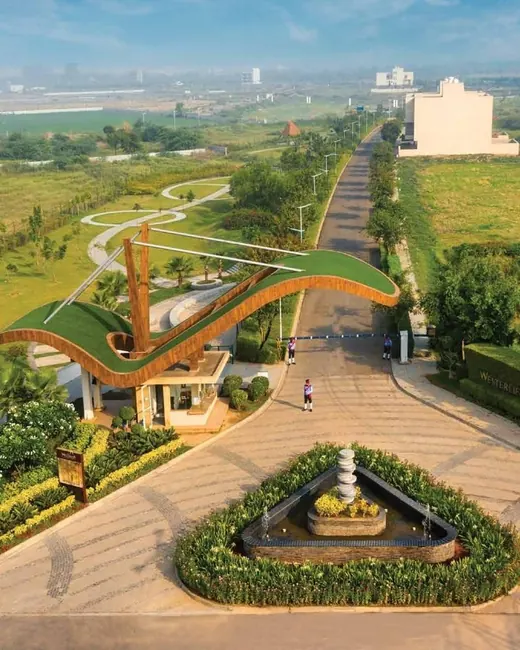 Experion The Westerlies — Aerial view of the arch entrance gate and approach road, actual photo