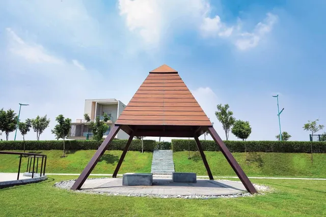 Experion The Westerlies — Timber pyramid pavilion in landscaped park, actual photo