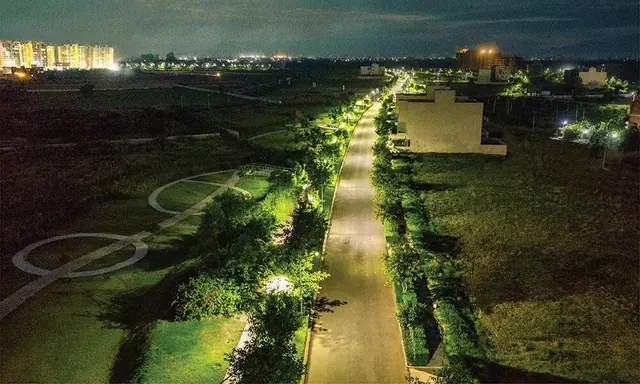 Experion The Westerlies — Lit internal road at night, actual photo