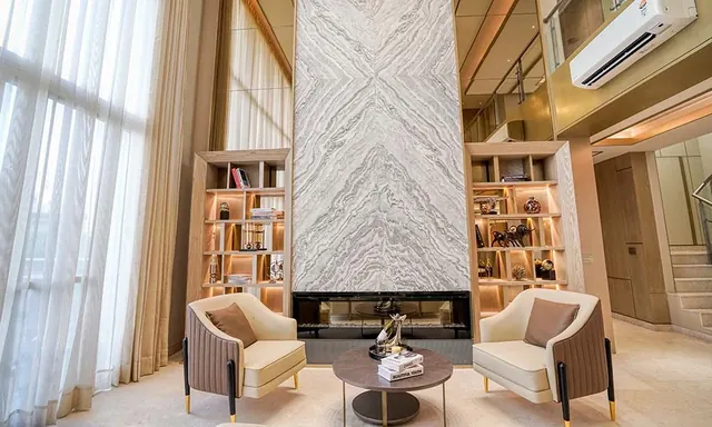 Experion Windchants — living area with fireplace wall (photo)
