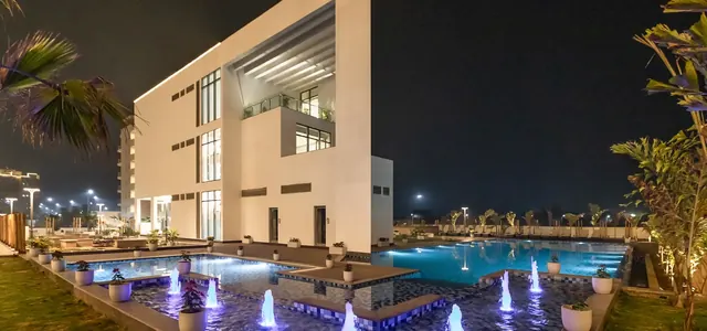 Godrej 101 — clubhouse and pool at night