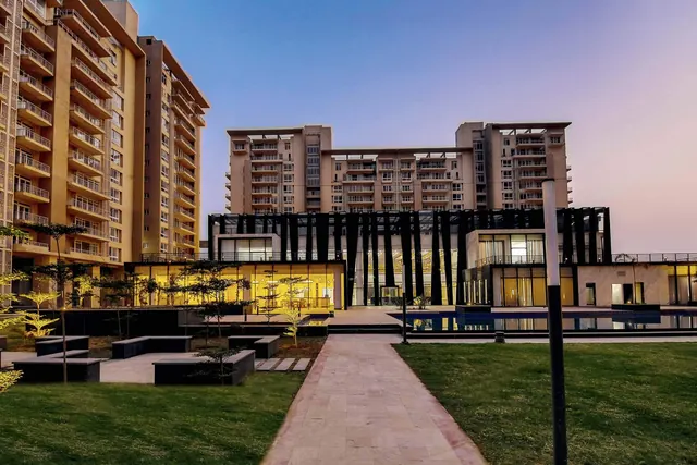 Indiabulls Enigma — landscaped lawn and clubhouse (actual photo)