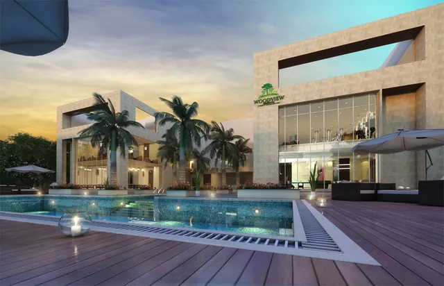 Lotus Woodview Residences — clubhouse with pool at dusk