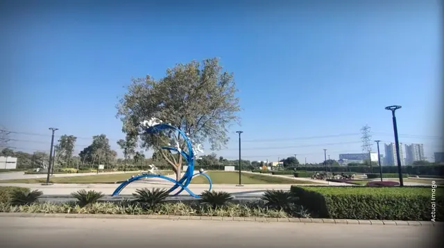 M3M 114 Market — actual site photo - sculpture and greens