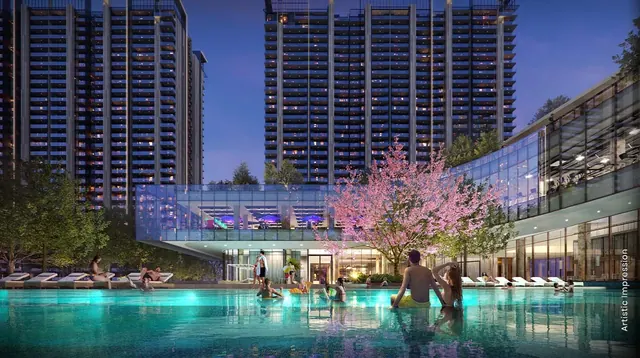 M3M Golf Hills — towers and clubhouse pool at dusk