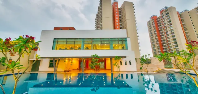 Mahindra Aura — clubhouse with pool (real photo)