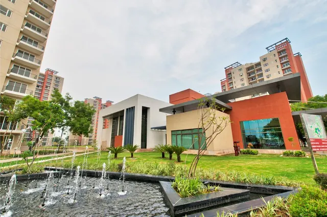 Mahindra Aura — clubhouse and fountain garden (real photo)