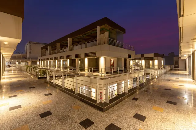 Ocus Medley — High-street retail terrace at night (actual)
