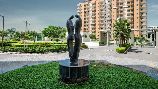 Orris Carnation Residency — sculpture roundabout and towers (real photo)