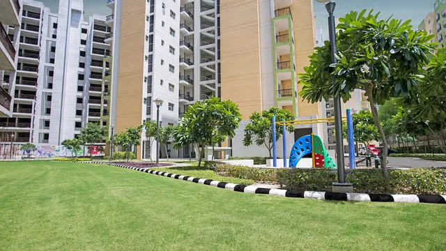 Orris Carnation Residency — lawn and kids play area (real photo)