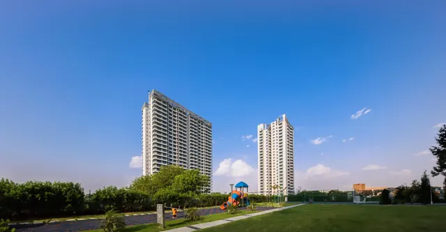 Paras Dews — towers across park (real photo)