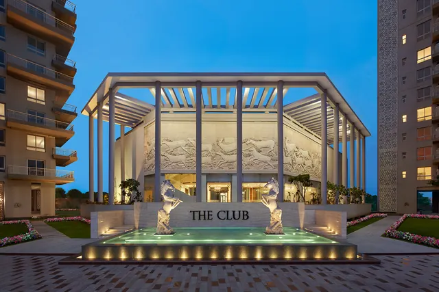 Puri Diplomatic Greens — The Club pavilion at dusk (real photo)