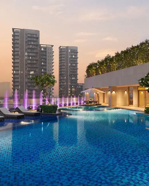 Puri Diplomatic Residences — towers and rooftop pool at sunset (real photo)