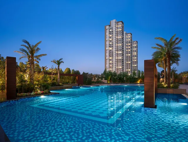 Puri Emerald Bay — pool and tower at dusk (real photo)