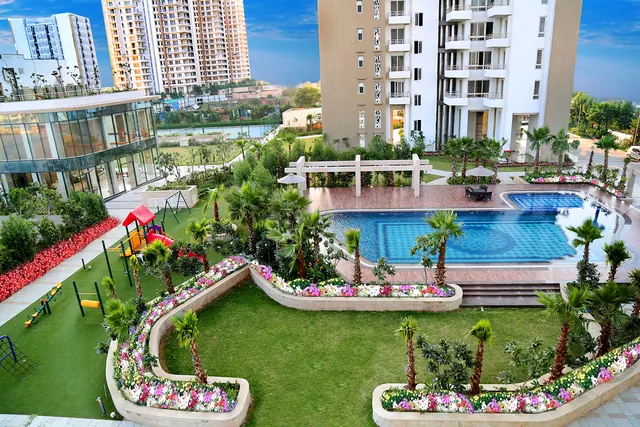 Puri Emerald Bay — podium garden and pool (real photo)