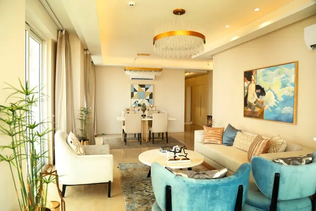 Puri Emerald Bay — sample apartment living/dining (real photo)