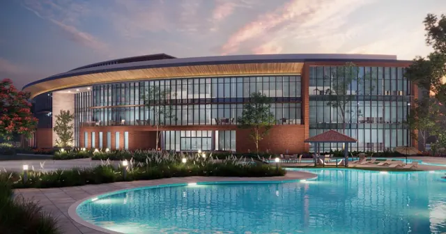 Clubhouse and pool at dusk