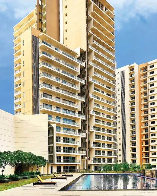 Tata Gurgaon Gateway — towers with clubhouse and pool (actual photo)