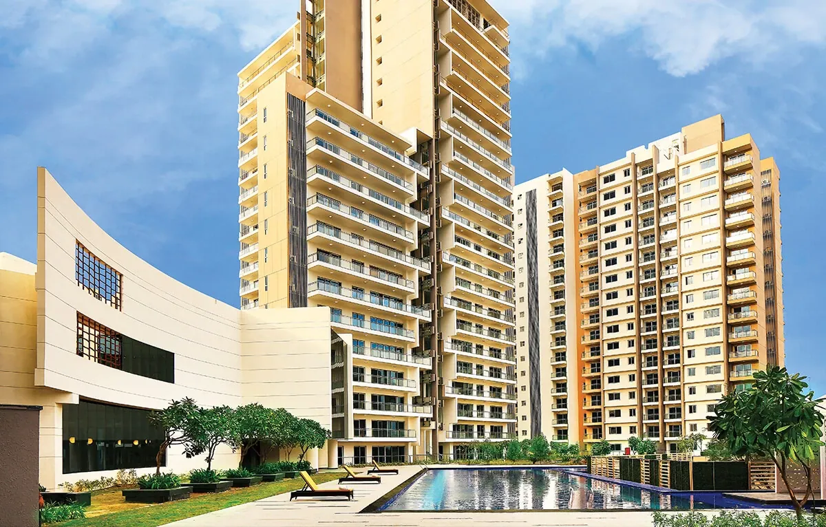 Tata Gurgaon Gateway — towers with clubhouse and pool (actual photo)