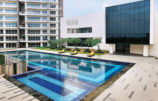 Tata Gurgaon Gateway — outdoor pool with towers (actual photo)