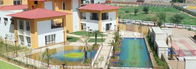 Vipul Lavanya — clubhouse and pool (actual photo, slider)